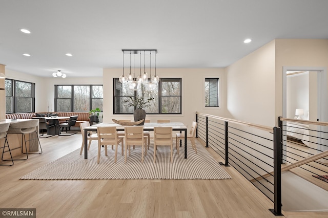 dining room with recessed lighting and light wood-type flooring
