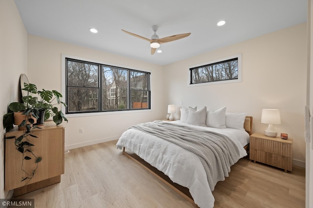 bedroom featuring recessed lighting, baseboards, ceiling fan, and light wood-type flooring