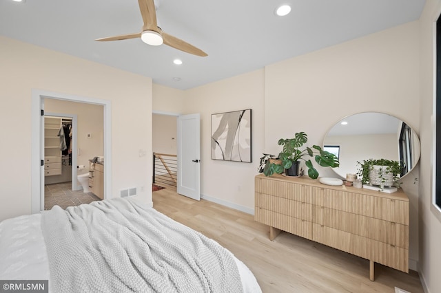 bedroom featuring ceiling fan, visible vents, baseboards, recessed lighting, and light wood-style flooring