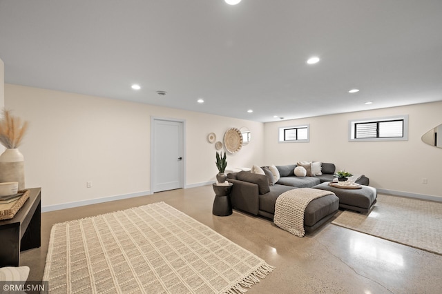 living area with baseboards and recessed lighting
