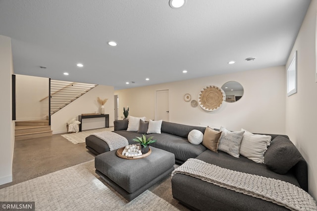 living area with stairway, baseboards, and recessed lighting