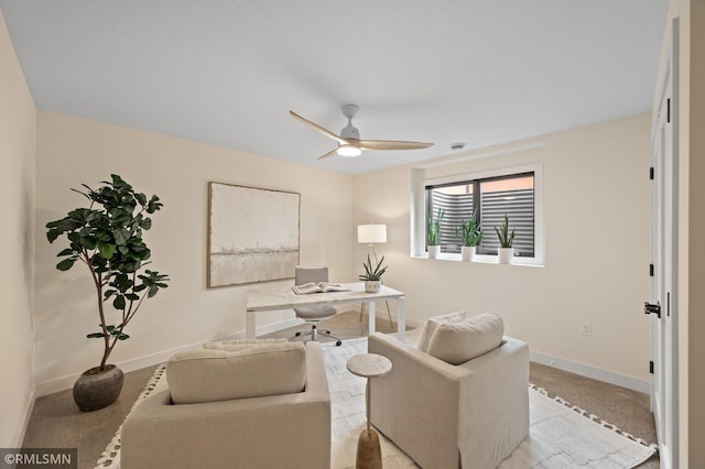 office area featuring baseboards and ceiling fan