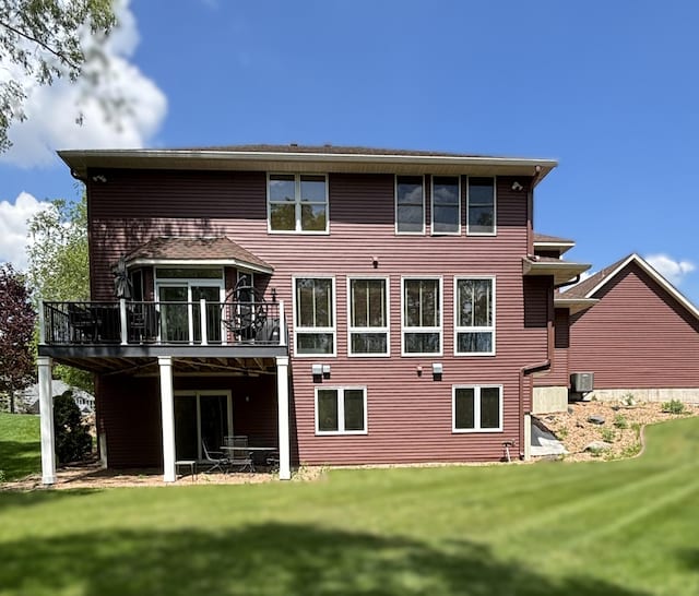 17397 73rd Pl N, Maple Grove, MN 55311 - rear view of property featuring a wooden deck and a lawn