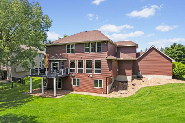17397 73rd Pl N, Maple Grove, MN 55311 - back of property featuring a wooden deck and roof with shingles
