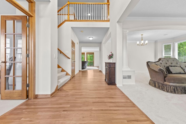 17397 73rd Pl N, Maple Grove, MN 55311 - foyer featuring stairway, crown molding, wood finished floors, and healthy amount of natural light