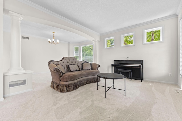 17397 73rd Pl N, Maple Grove, MN 55311 - living area with decorative columns, crown molding, carpet floors, a chandelier, and a fireplace