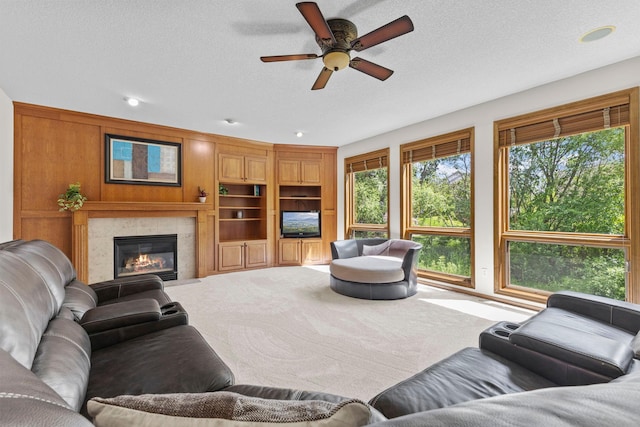 17397 73rd Pl N, Maple Grove, MN 55311 - living room with ceiling fan, a fireplace, a textured ceiling, recessed lighting, and carpet floors