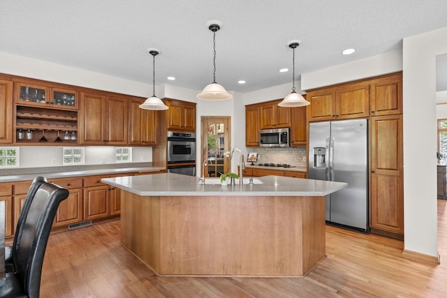 17397 73rd Pl N, Maple Grove, MN 55311 - kitchen with appliances with stainless steel finishes, brown cabinetry, recessed lighting, and light countertops
