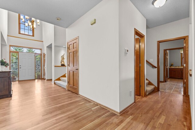 17397 73rd Pl N, Maple Grove, MN 55311 - entryway with stairs, light wood-style flooring, and a chandelier