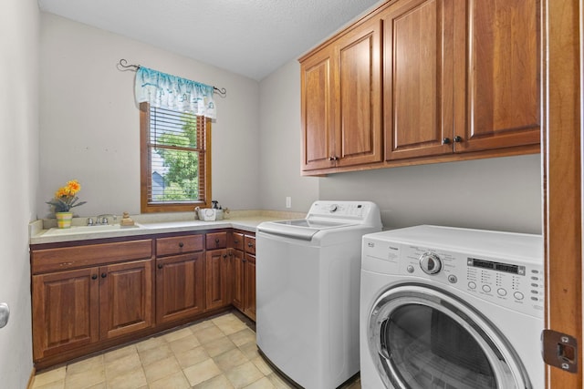 17397 73rd Pl N, Maple Grove, MN 55311 - laundry area with cabinet space, separate washer and dryer, and a textured ceiling