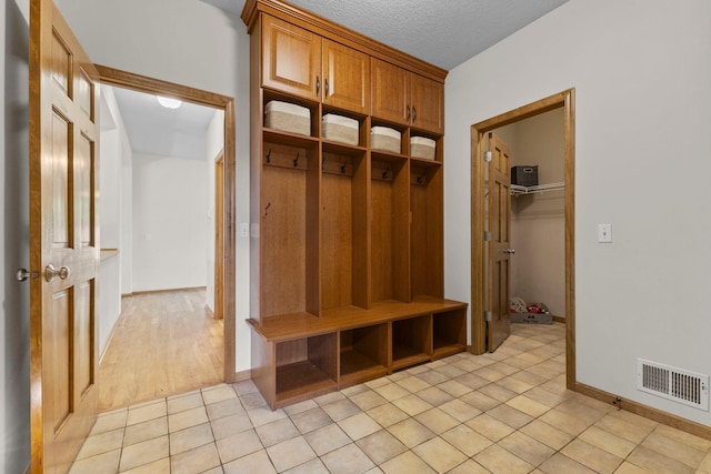 17397 73rd Pl N, Maple Grove, MN 55311 - mudroom featuring light tile patterned floors and baseboards