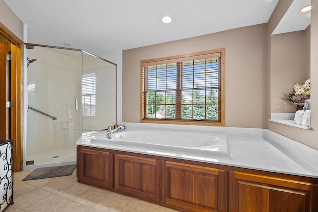 17397 73rd Pl N, Maple Grove, MN 55311 - bathroom with a stall shower, a bath, tile patterned flooring, and recessed lighting