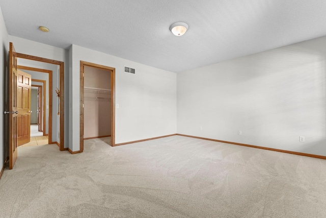17397 73rd Pl N, Maple Grove, MN 55311 - unfurnished bedroom with light colored carpet, a closet, and a spacious closet
