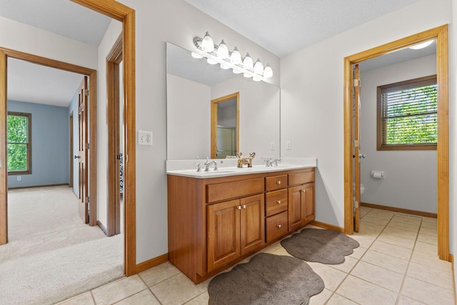 17397 73rd Pl N, Maple Grove, MN 55311 - bathroom featuring double vanity and tile patterned flooring