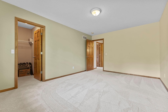 17397 73rd Pl N, Maple Grove, MN 55311 - unfurnished bedroom featuring light colored carpet, a spacious closet, and a closet