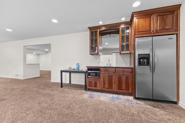 17397 73rd Pl N, Maple Grove, MN 55311 - kitchen featuring appliances with stainless steel finishes, light colored carpet, glass insert cabinets, recessed lighting, and brown cabinets