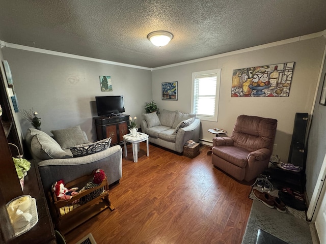 living room featuring visible vents, a textured ceiling, wood finished floors, crown molding, and baseboard heating