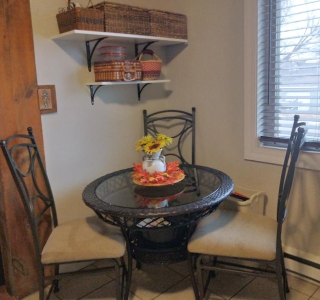dining area with tile patterned flooring