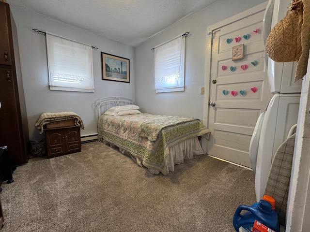 bedroom with a textured ceiling, carpet flooring, and a baseboard radiator