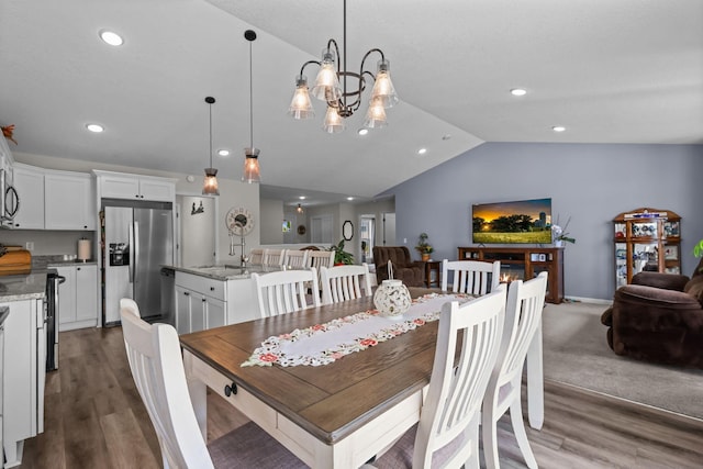 941 Whiskey Rd NW, Isanti, MN 55040 - dining space featuring vaulted ceiling, wood finished floors, recessed lighting, and a chandelier