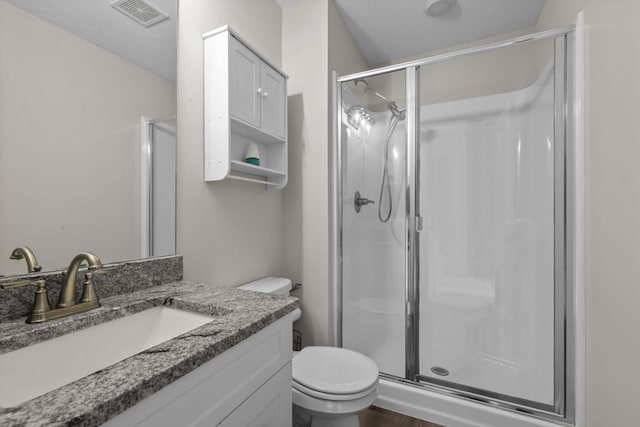 941 Whiskey Rd NW, Isanti, MN 55040 - bathroom with a stall shower, vanity, and toilet