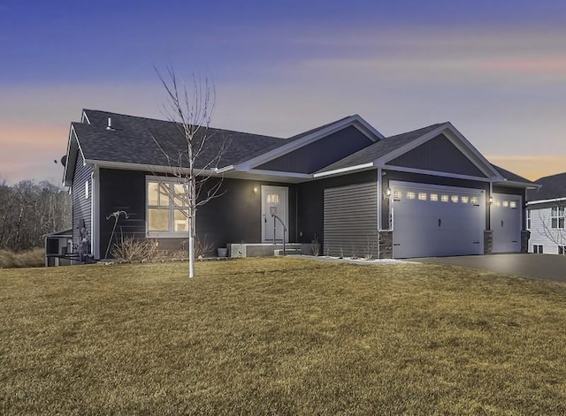941 Whiskey Rd NW, Isanti, MN 55040 - ranch-style home featuring an attached garage, a lawn, concrete driveway, and roof with shingles