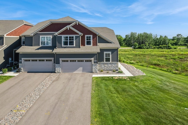 6767 Bluestem Way, Minnetrista, MN 55331 - view of front of house featuring asphalt driveway, stone siding, a front yard, an attached garage, and roof with shingles