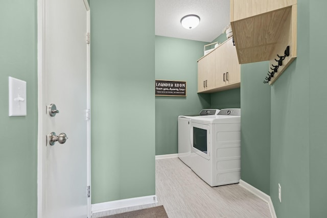 6767 Bluestem Way, Minnetrista, MN 55331 - laundry area featuring cabinet space and separate washer and dryer