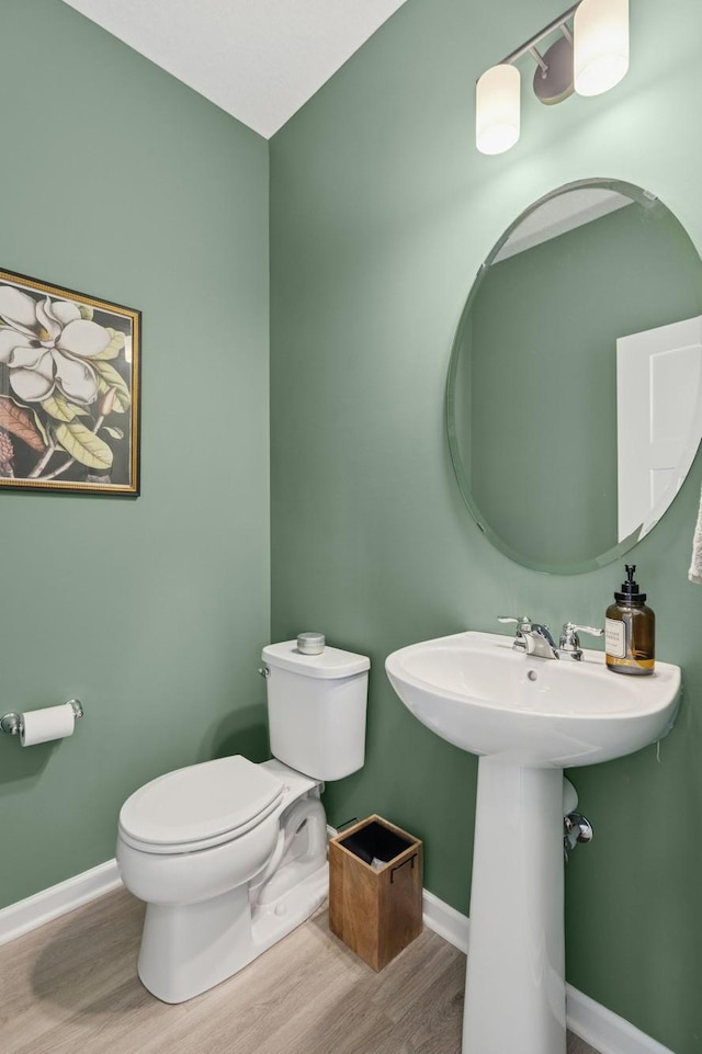 6767 Bluestem Way, Minnetrista, MN 55331 - bathroom with wood finished floors and toilet