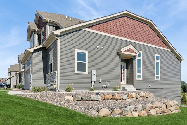 6767 Bluestem Way, Minnetrista, MN 55331 - rear view of house with a yard