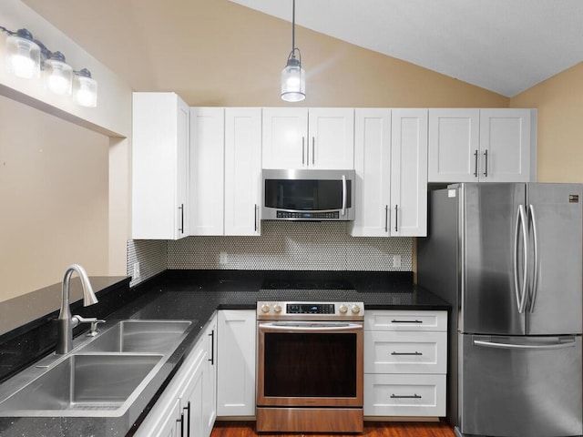 7605 Edinborough Way Unit 6314, Edina, MN 55435 - kitchen featuring backsplash, appliances with stainless steel finishes, vaulted ceiling, a sink, and white cabinets
