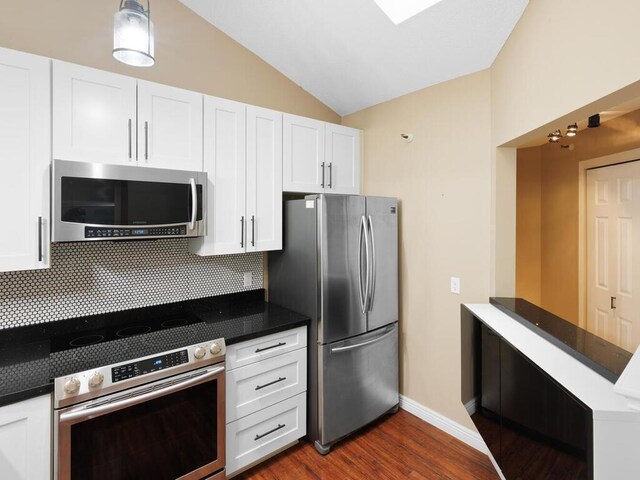 7605 Edinborough Way Unit 6314, Edina, MN 55435 - kitchen featuring backsplash, dark countertops, stainless steel appliances, white cabinetry, and dark wood-type flooring