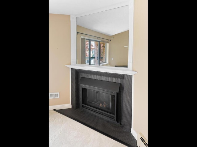 7605 Edinborough Way Unit 6314, Edina, MN 55435 - details featuring visible vents, a fireplace, baseboards, a baseboard heating unit, and carpet flooring