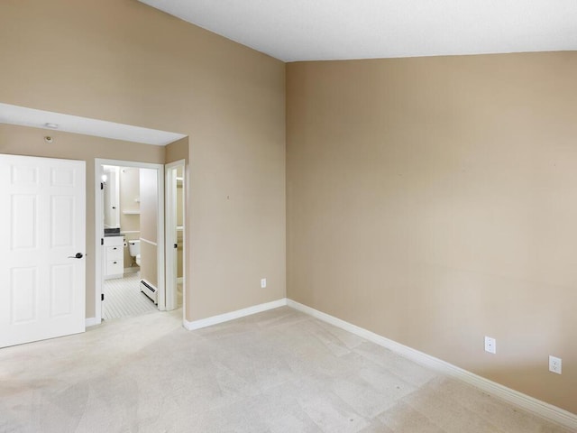 7605 Edinborough Way Unit 6314, Edina, MN 55435 - spare room with baseboards, light carpet, and a baseboard heating unit