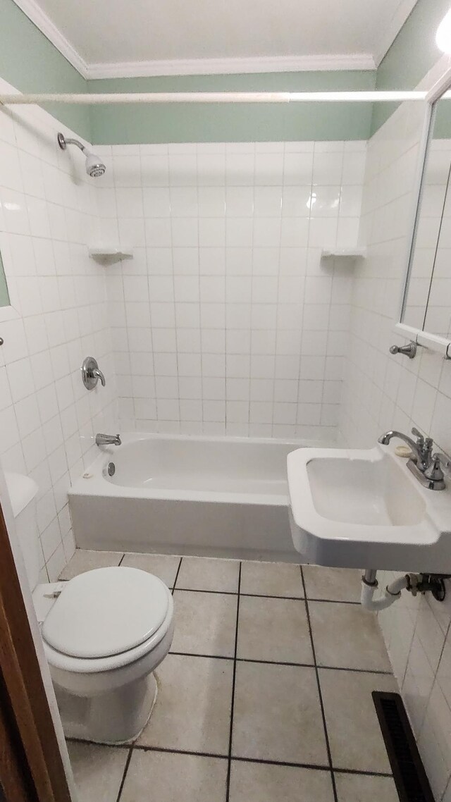 302 Elmwood St, Arlington, MN 55307 - full bath featuring crown molding, toilet, a sink, tile patterned floors, and tile walls