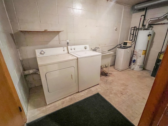 302 Elmwood St, Arlington, MN 55307 - clothes washing area with gas water heater, washer and clothes dryer, concrete block wall, and a sink