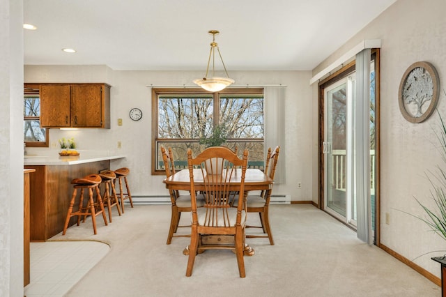 dining room with plenty of natural light, light colored carpet, baseboards, and recessed lighting