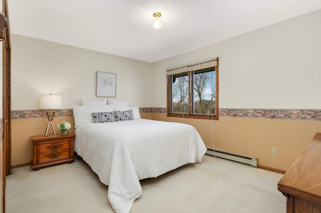 bedroom featuring a baseboard radiator, carpet floors, and baseboards