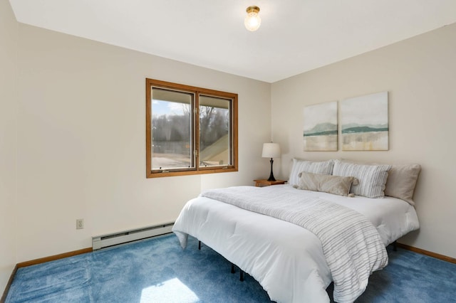 carpeted bedroom featuring a baseboard heating unit and baseboards