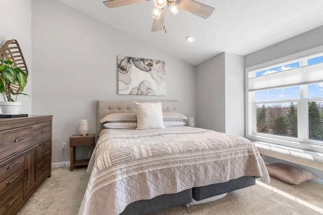 8945 Village Loop, Chanhassen, MN 55317 - bedroom featuring light carpet, lofted ceiling, and a ceiling fan