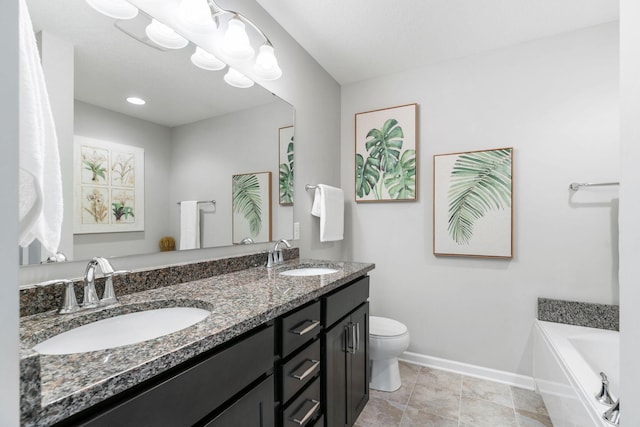 8945 Village Loop, Chanhassen, MN 55317 - bathroom with baseboards, toilet, a bathtub, and double vanity