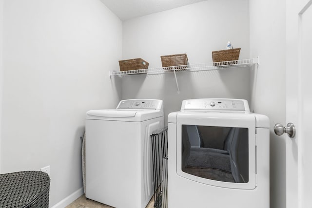 8945 Village Loop, Chanhassen, MN 55317 - laundry room featuring washer and dryer and baseboards