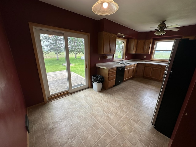 10855 150th St NE, Spicer, MN 56288 - kitchen featuring freestanding refrigerator, dishwasher, light countertops, and a ceiling fan