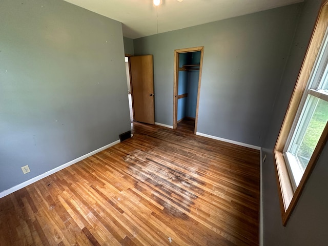 10855 150th St NE, Spicer, MN 56288 - unfurnished bedroom featuring wood finished floors, baseboards, and a closet
