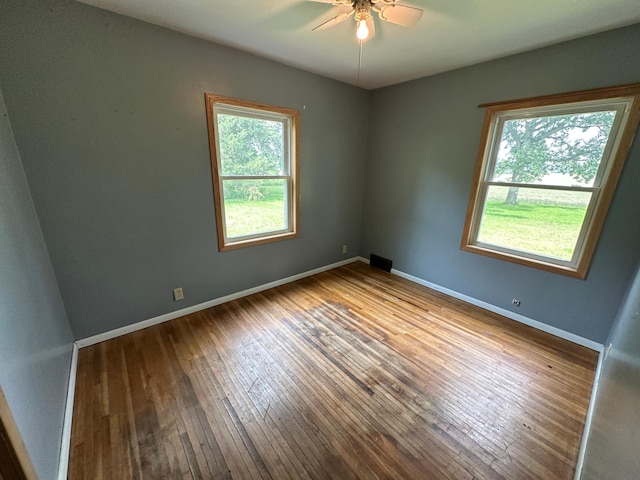 10855 150th St NE, Spicer, MN 56288 - empty room with hardwood / wood-style floors, a ceiling fan, and baseboards