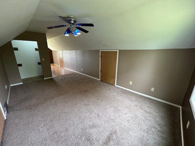 10855 150th St NE, Spicer, MN 56288 - additional living space featuring vaulted ceiling, carpet flooring, a ceiling fan, and baseboards