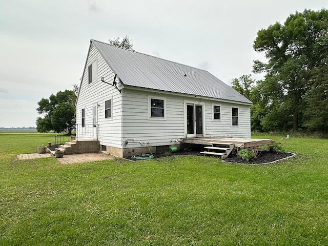 10855 150th St NE, Spicer, MN 56288 - back of house with a lawn and metal roof