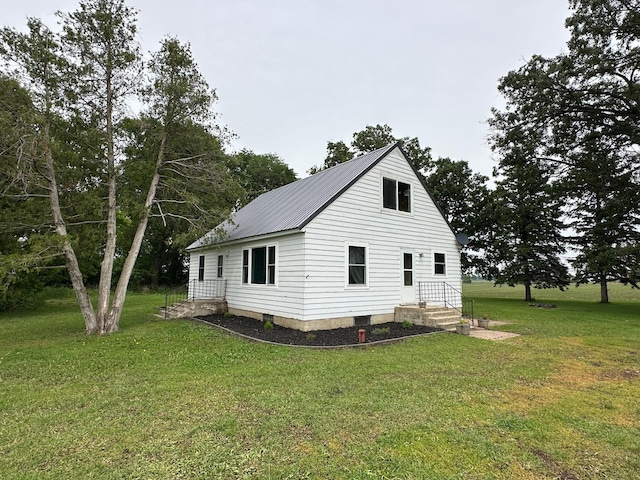 10855 150th St NE, Spicer, MN 56288 - view of home's exterior with a lawn and metal roof