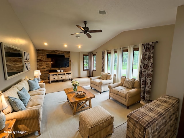 6480 Long Lake Rd, Willmar, MN 56201 - living area featuring vaulted ceiling, a ceiling fan, and light colored carpet