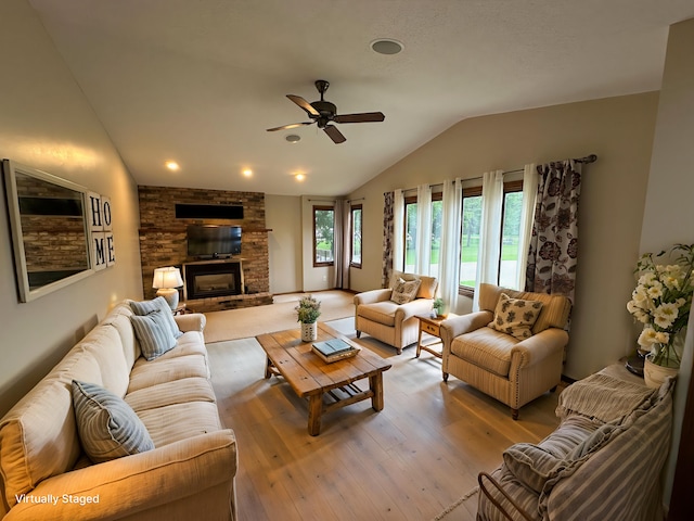 6480 Long Lake Rd, Willmar, MN 56201 - living area with vaulted ceiling, ceiling fan, light wood-style flooring, and a fireplace